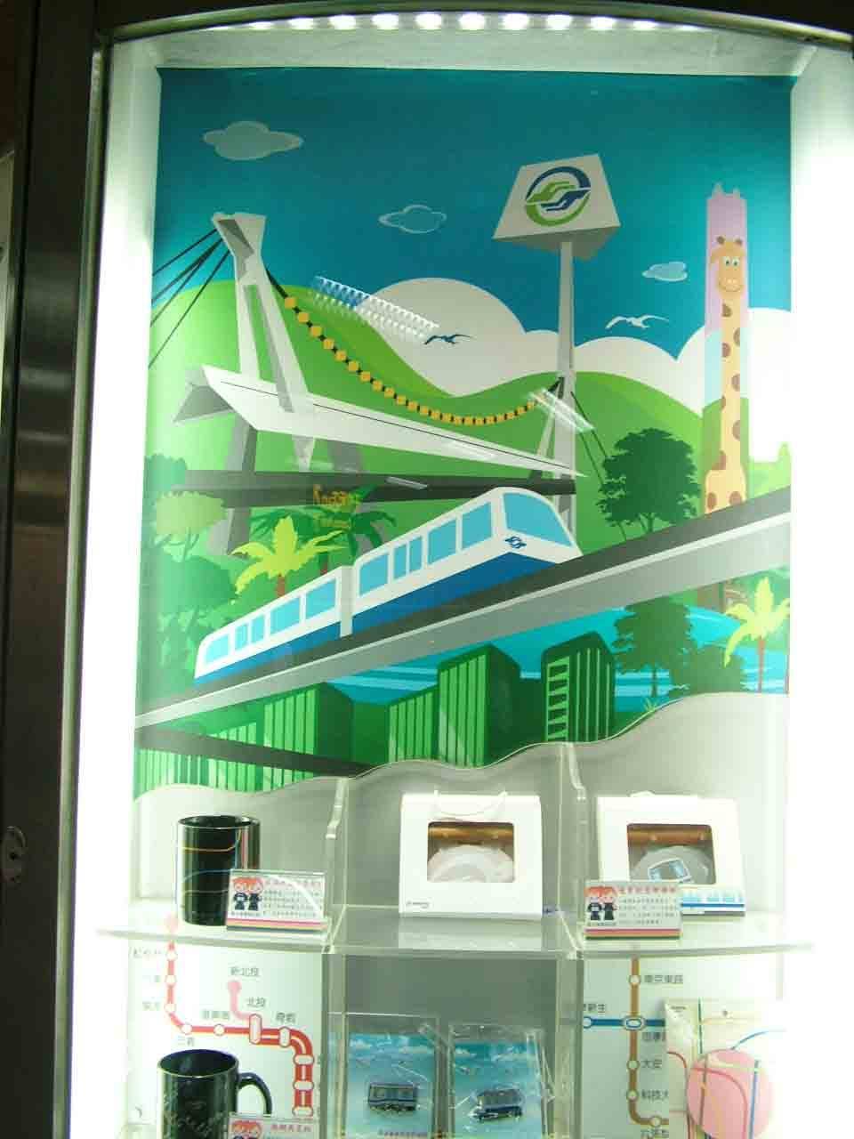 電梯間燈箱大圖輸出，文湖線高架軌道與長頸鹿意象插畫